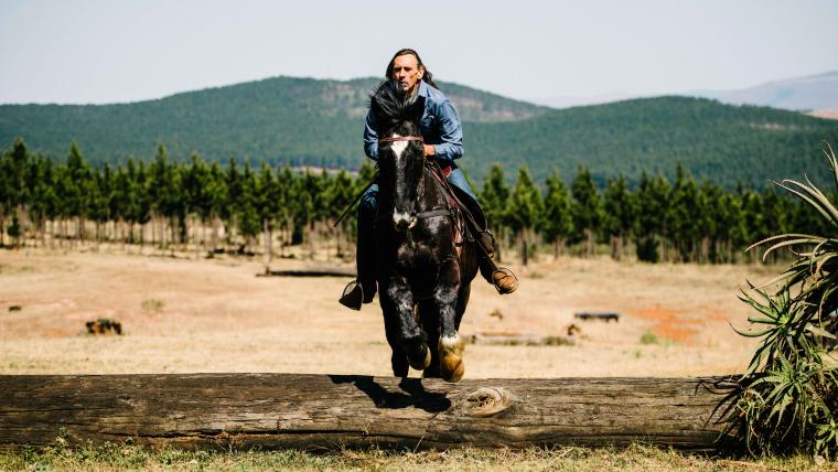 Man riding horse