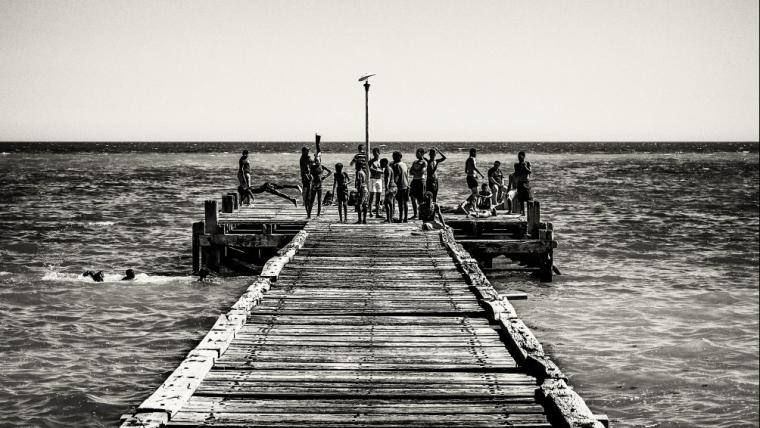 Children on bridge at beach