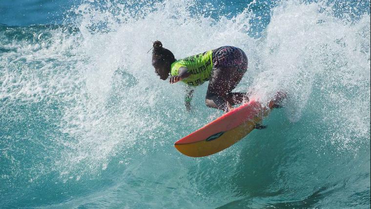 Young female surfing