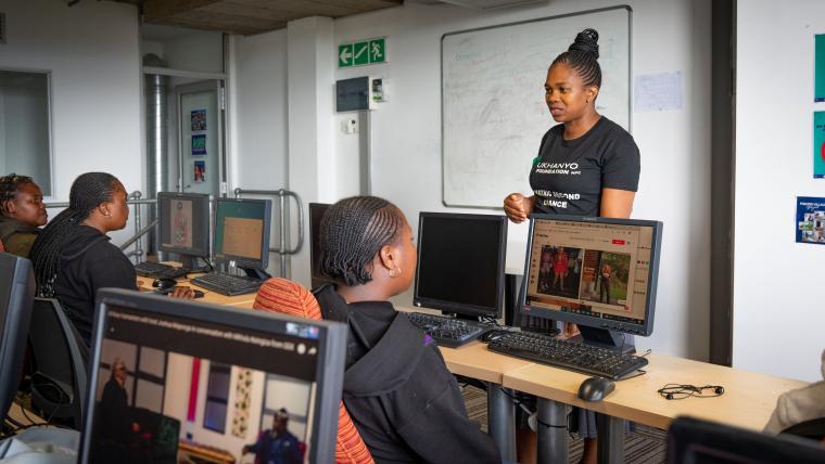 Sandi Gwele of Ukhanyo Foundation talks to students