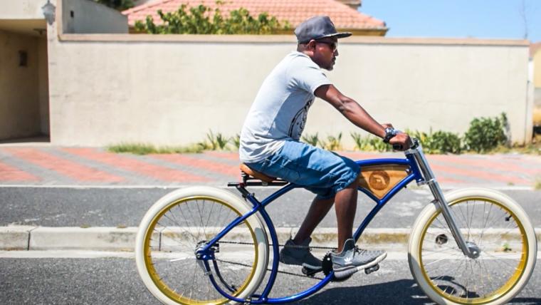 man riding vintage bicycle