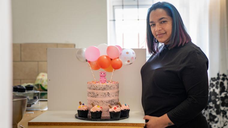 Beautiful News - Shaundre Lottering of Taste of Heaven standing beside one of her cake creations