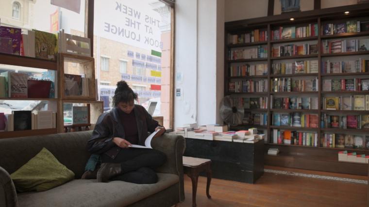 Young girl reading a book.