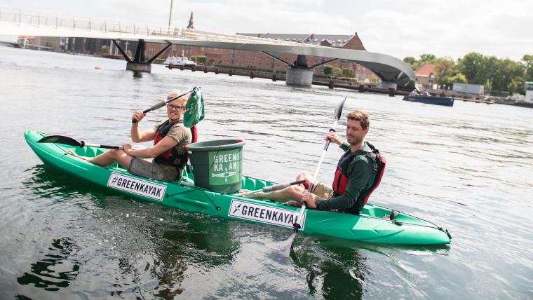 Beautiful News-Two men in a green kayak