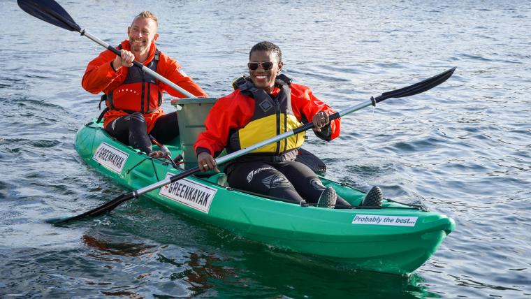 Beautiful News-Man and woman in a green kayak