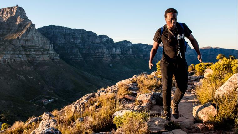 Man hiking up mountain