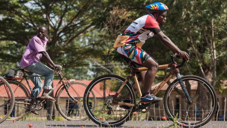 Beautiful News-Two men riding bicycles