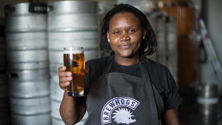 Woman holding a beer