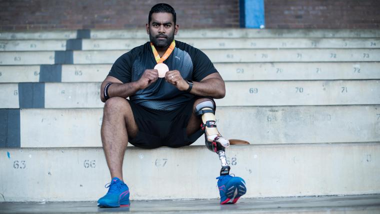 Paralympian holding medal