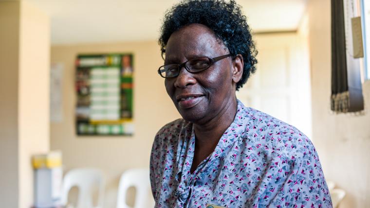 Black nurse smiling at the camera